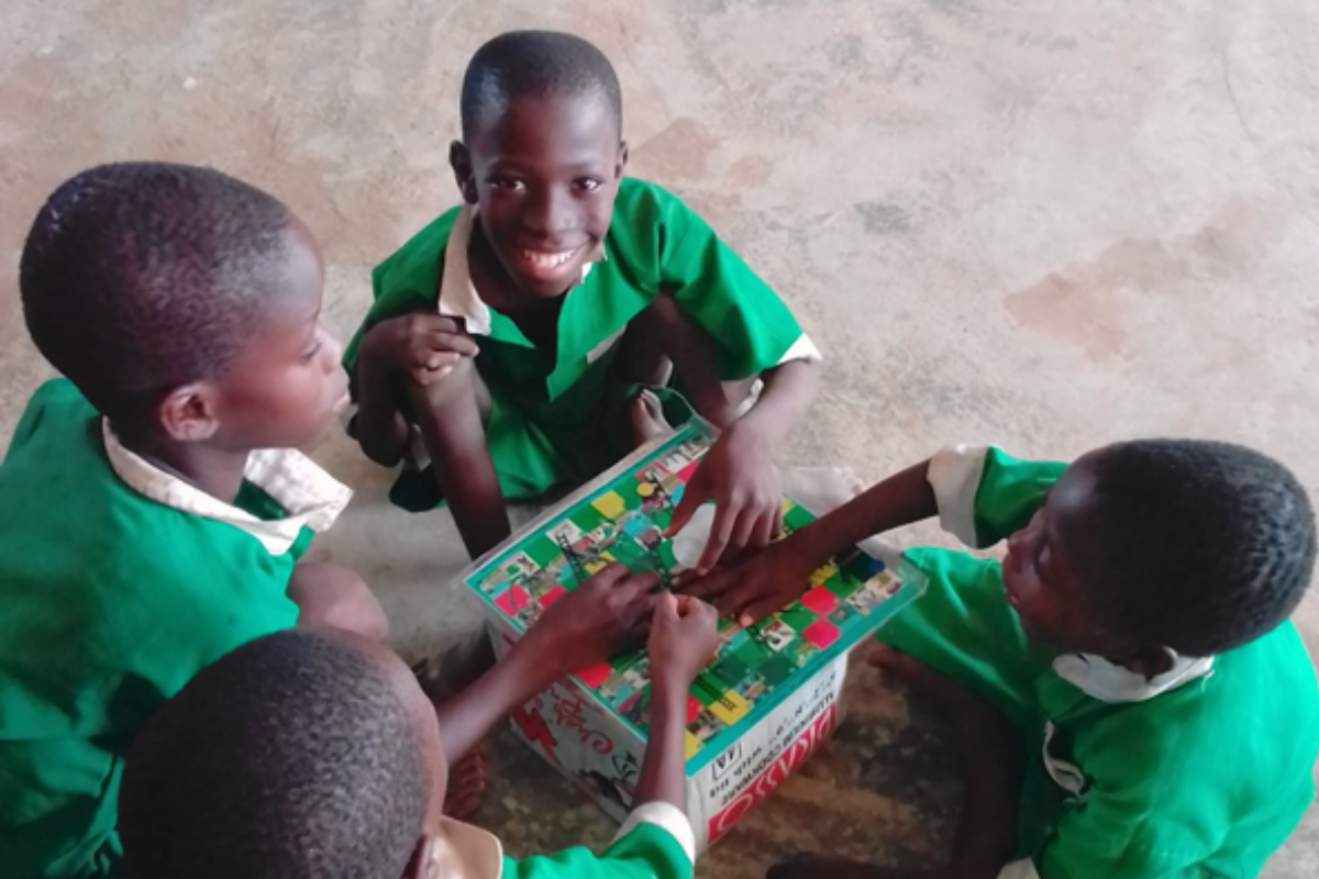 Plate 4: School children playing the Schisto and Ladders™ board game