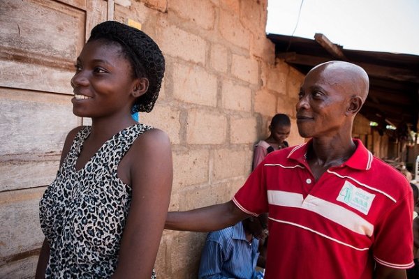 A young woman is measured using a dose pole to determine her correct dosage of medicine during an NTDs mass drug administration in Cross River State, Nigeria.&nbsp;© RTI International/Ruth McDowall